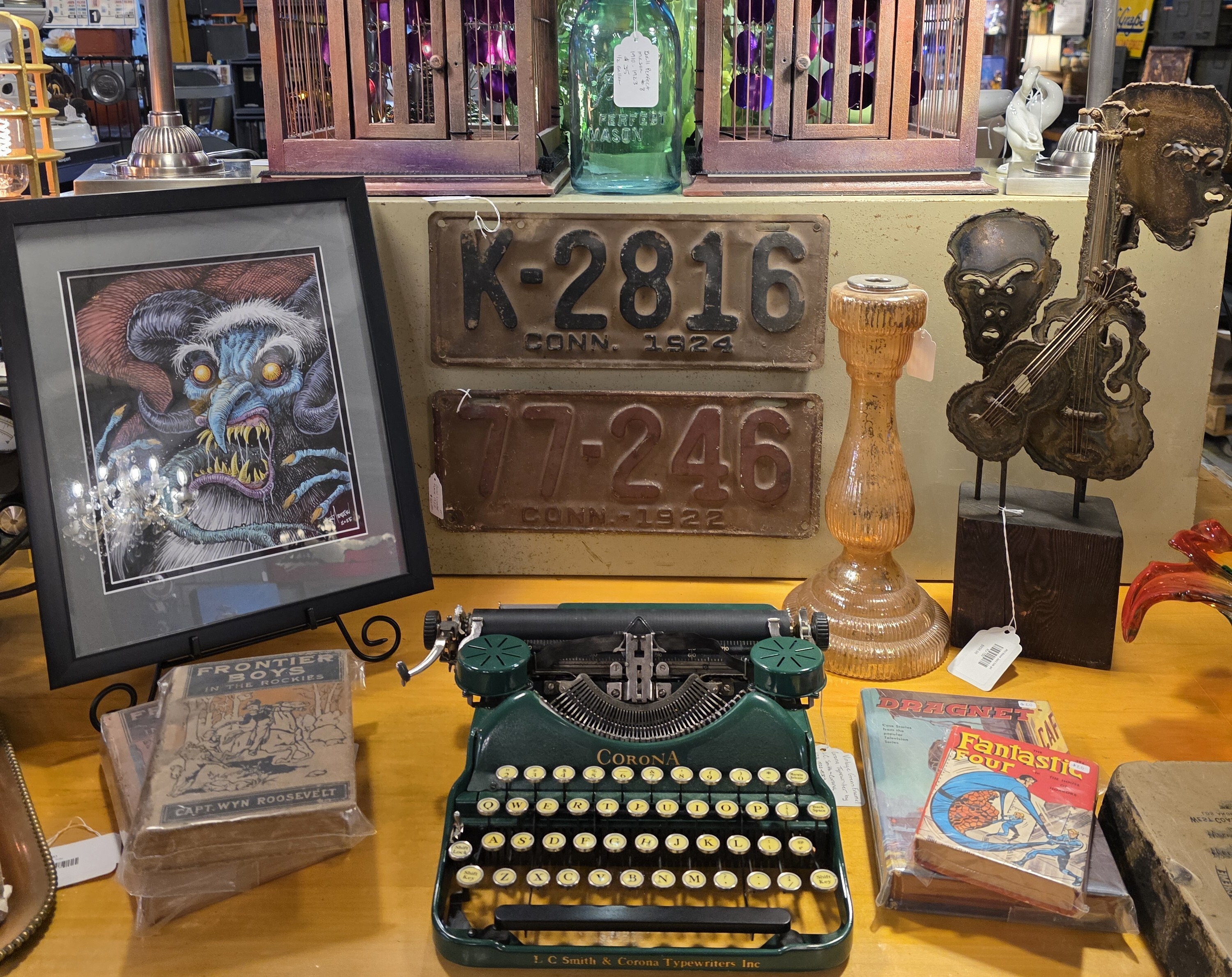 Vintage Typewriter and Collectibles Display Electro-Illuminarie lamp, Kurt M. Andersen original drawing, vintage Connecticut license plates, Corona typewriter, vintage comics and books Industrial Treasures St Charles IL